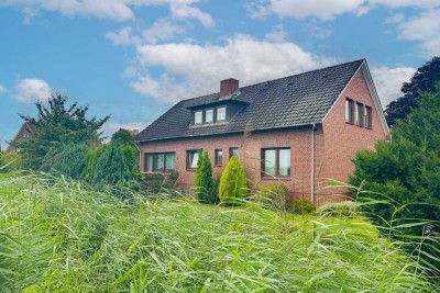 Gestaltbares Zuhause in Jork: EFH mit Südwest-Garten, Garagen und Sanierungsbedarf