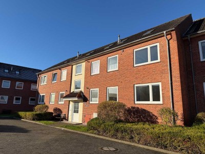 Büsum: Schicke Hochparterre-Wohnung mit Westbalkon in ruhiger Zentrumslage