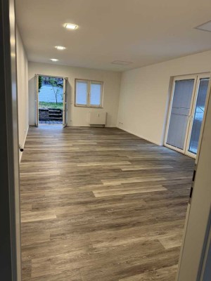 Moderne 1-Zimmer-Wohnung mit privatem Garten – direkt am Rhein in Köln-Langel