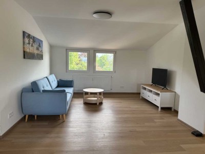 Erstbezug mit Balkon und EBK: Exklusive 2-Raum-Dachgeschosswohnung mit geh. Innenausstattung