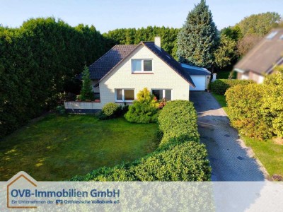 Einfamilienhaus mit Garage und großzügigem Grundstück