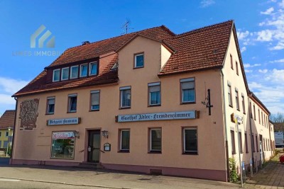 Mehrfamilienhaus mit Gewerbeeinheit und Baugrundstück zum Kauf
