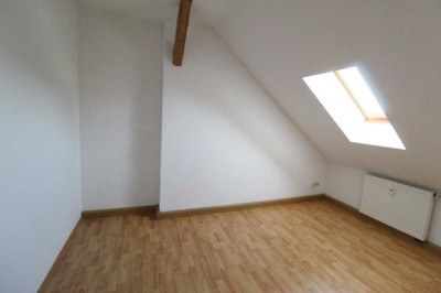 Dachgeschosswohnung mit Sichtbalken