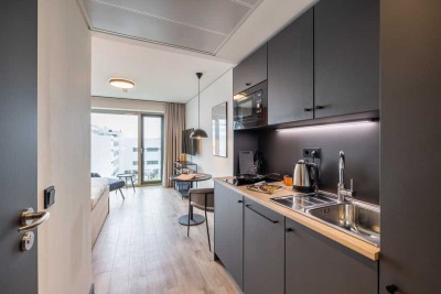 Coliving - furnished micro apartments, community areas, coworking & gym close to BMW