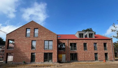 Neubauwohnung im Erdgeschoss mit Garten und überdachter Terasse