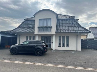 Charmantes Einfamilienhaus mit großem Garten, Doppelcarport und Garage  in Porta Westfalica