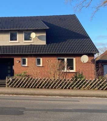 2-Zi EG-Wohnung mit eigenem Garten und Terrasse + Garage und Stellplatz