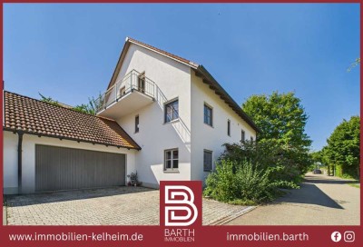 Vielseitiges Einfamilienhaus in ruhiger Hanglage und idyllischem Garten