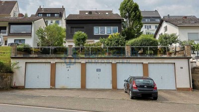 vermietetes MFH mit 3 Wohnungen und 5 Garagen in Trechtingshausen (WEG geteilt)