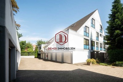 3-Zimmer-Terrassenwohnung mit großem Gartenanteil und 2 Garagen