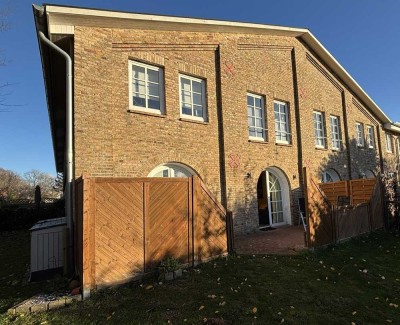 Sonnige Erdgeschosswohnung mit großzügiger Terrasse und Garten