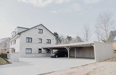 Neubau: Stilvolle 3-Zimmer-Erdgeschosswohnung mit Terrasse und Keller in Großenaspe