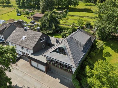 Einfamilienhaus und Kapitalanlage im Doppelpack - Traumhafte Grünanlage mit vielfältiger Nutzung