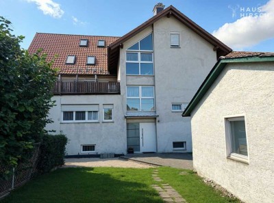 Großzügiges Mehrfamilienhaus mit Garten, Garagen & Gewerbebereich, ausgebauter Dachboden