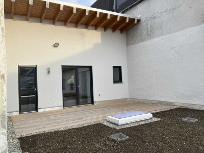 Erstbezug mit Terrasse und Einbauküche: Stilvolle 1-Zimmer-Wohnung mit geh. Innenausstattung