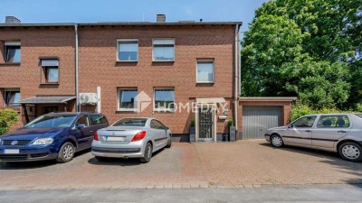 Vielseitiges Reihenendhaus mit Gartenidylle, drei Garagen und Potenzial für mehrere Generationen