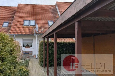Kompaktes Reihenmittelhaus mit Doppelcarport und kleinem Garten