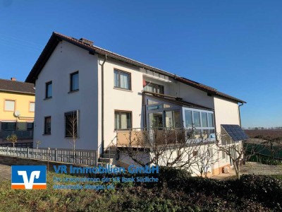 Flexibel nutzbares 2-3 Familienhaus mit sonnigem Grundstück und tollem Ausblick