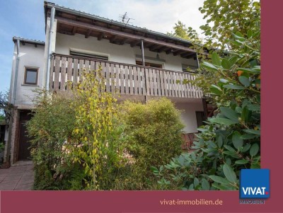 Charmantes Veranda-Wohnhaus mit Anbau, Garage und eingewachsenem Garten. Familienfreundliche Lage.