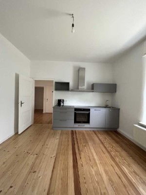Charmante 2-Zimmer-Wohnung mit Wohnküche und Kamin im Hessheimer Viertel