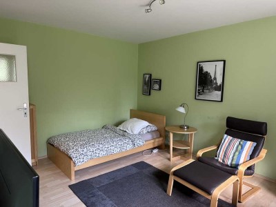 Komplett möbliertes und modernes 1-Zimmer-Apartment mit Gemeinschaftsgarten