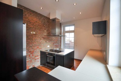 Stilvolle 3,5-Zimmer-Wohnung mit Loft-Charakter und Garten