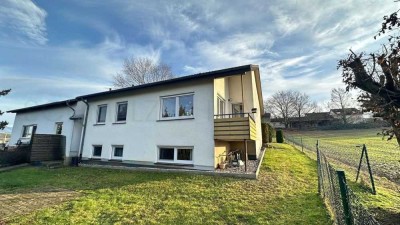 Mehrfamilienhaus mit Garten und Garage + Baugrundstück optional