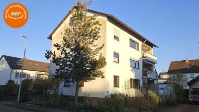 "Großzügige Eigentumswohnung mit Balkon, Gartenanteil und Garage"