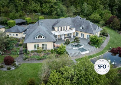 Villa mit hoch gepflegter Außenanlage mit traumhafter Zufahrt auf einem 8.497 m² Grundstück