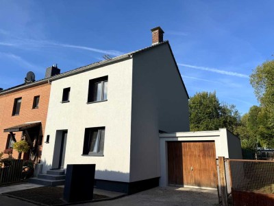 **Reihenendhaus mit Garage, Terrasse, neuer Dämmung und großem Potenzial - Sanierungsbedürftig**