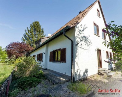 Vielseitiges Anwesen: Mehrfamilienhaus auf großem Grundstück mit Platz für Neubau!