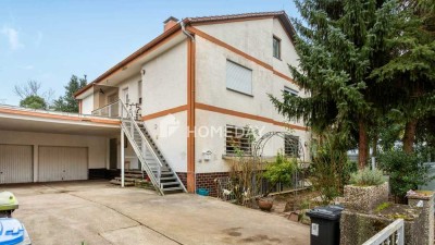 Traumhaftes Mehrfamilienhaus mit großzügigem Garten, luxuriösem Badezimmer und Wintergarten