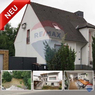 Stadthaus mit zwei Parteien und Ausbaureserve in ruhiger Lage.