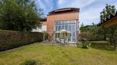Ruhige Wohnung mit Reihen-Eckhausfeeling, großem Garten, kleinem Wintergarten, Keller und Tiefgarage