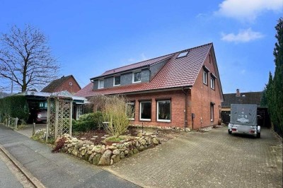 Tolle Wohnung im EG eines Zweifamilienhauses mit Garten und Carport