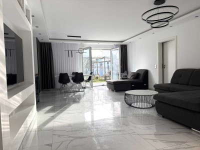 Baujahr 2023: Eigentumswohnung in gefragter Lage mit Garten und TG-Platz