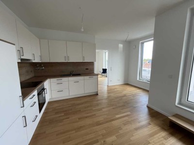 Penthouse-Feeling: Neubau-Erstbezug mit großer Dachterrasse & TG-Stellplatz