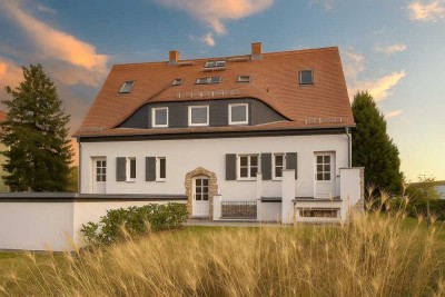 Exklusive Wohnung mit Gartenanteil und Fitness- sowie Saunabereich – Erstbezug nach Sanierung