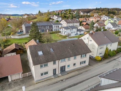 Vielseitiges 4-Familienhaus als Doppelhaus mit Garten