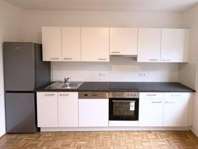 Erstbezug: 2 ZIMMER-Neubau, ruhiger Süd-Balkon 7,5m², Wohnküche, neue Sanitäranlagen, Lift, TG-Platz