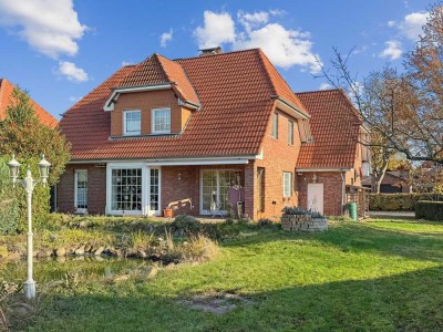 Stilvolles Einfamilienhaus mit Einliegerwohnung, großem Grundstück & Doppelgarage in Meine–Grassel