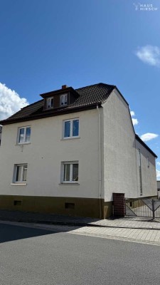 4-Familienhaus mit Hallen & großem Bauplatz direkt am Main