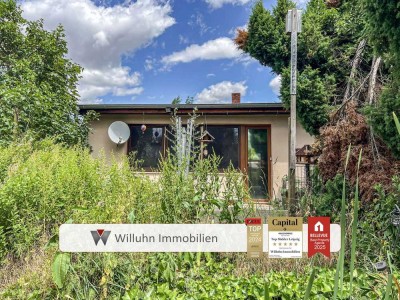 Gemütlicher Bungalow mit idyllischem Grundstück: Perfekt zum Ausbauen und Platz für etwas Neues!