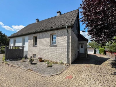Doppelhaushälfte mit Charme, Potenzial und großem Garten in Lengerich