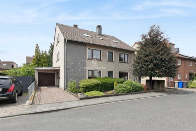 Freistehendes 3-Familienhaus mit 241 m² Wohnfläche, 2 Garagen und Garten in guter Lage von Wesseling