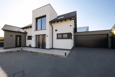 Familienidyll am Feldrand: KfW-40+ Traumhaus mit großem Südwest-Garten und Einliegerwohnung