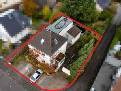 Rösrath-Zentrum: Freistehendes Einfamilienhaus oder Baugrundstück in zentraler und ruhiger Lage!