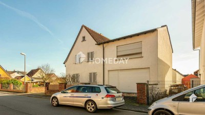 Doppelt erschlossen: EFH mit Wintergarten, Keller und Garage + großes Bauland auf der Rückseite