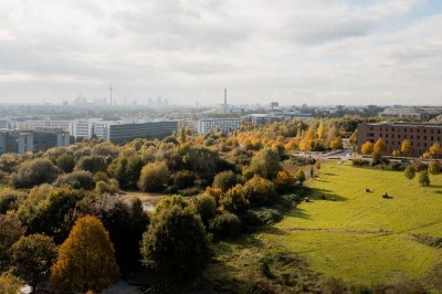 Skyline- und Parkblick: Helle 3-Zimmer-Wohnung mit einzigartiger Eck-Loggia