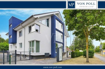 Sonnige und moderne Dachgeschosswohnung mit Pachtgarten und Pkw-Stellplatz